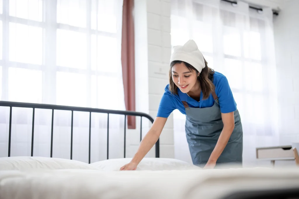 asian-young-beautiful-cleaner-worker-making-bed-in-2024-08-29-16-25-53-utc