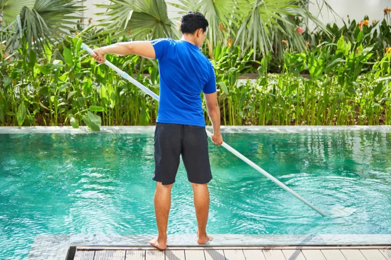young-man-cleaning-pool-2023-11-27-04-55-45